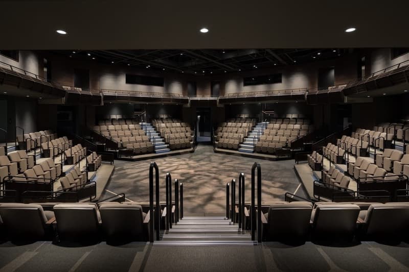 Seats wrapping the thrust stage seen from the back row